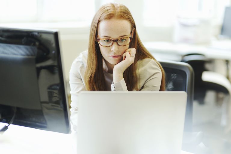 female web developer working on computer