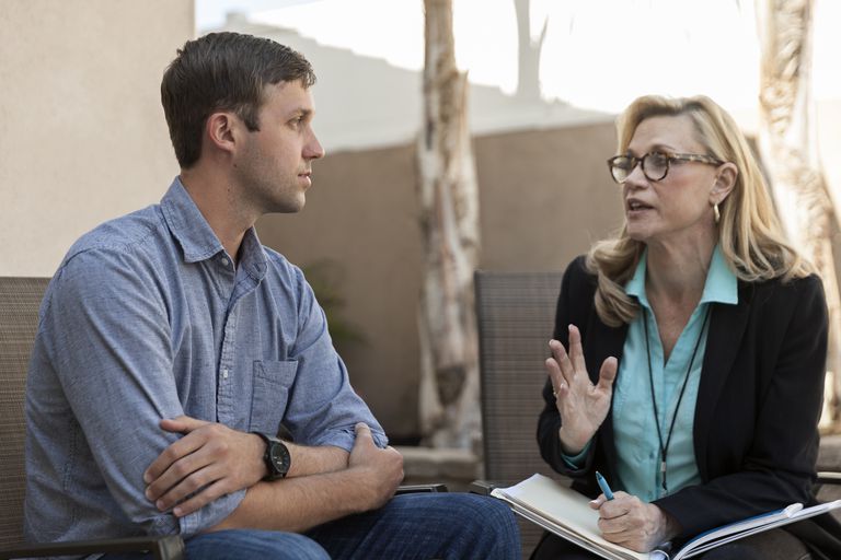 Man talking with therapist in therapy