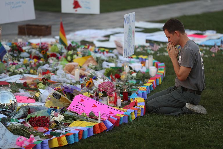 A man prays before a memorial to the victims of the Pulse nightclub mass shooting in Orlando, Florida. Mass shootings in the U.S. have been on the rise for decades.