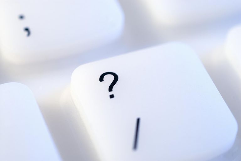 Question mark key on keyboard close-up