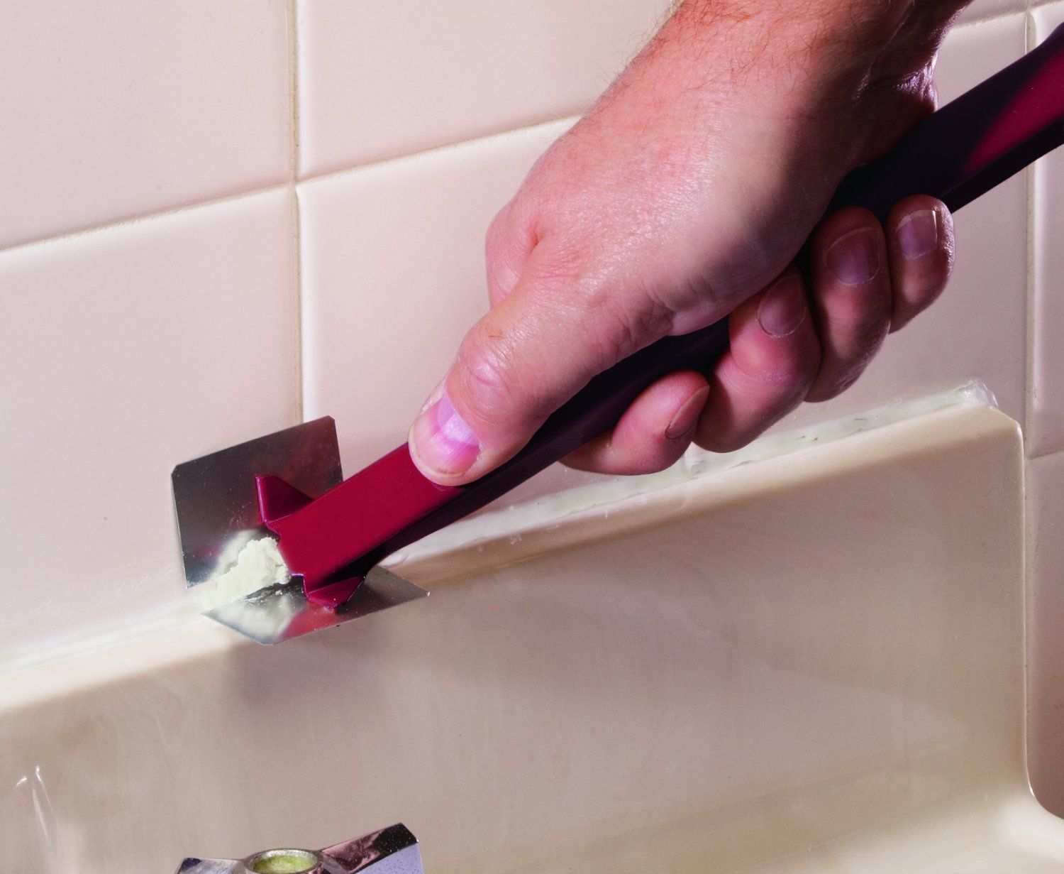 removing caulk from kitchen sink