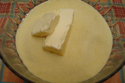 Blend in the butter to form a crumbly mixture.