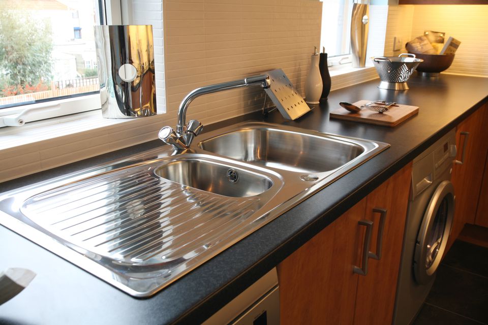kitchen sink with built in adjustable cutting boards