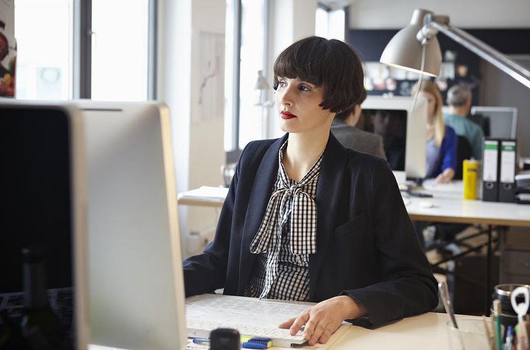 Men and women working in office