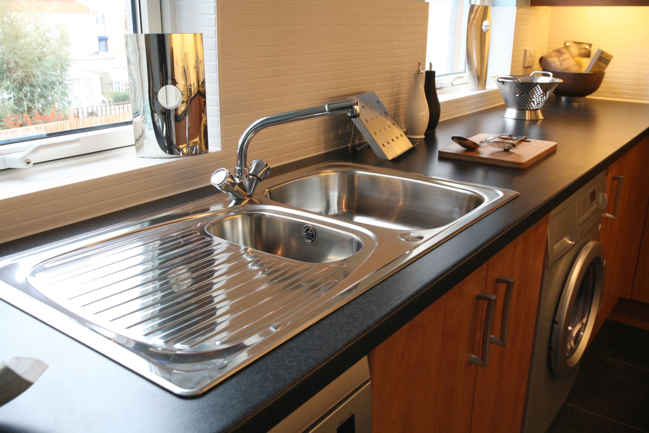 kitchen sink with drainboard and cutting board