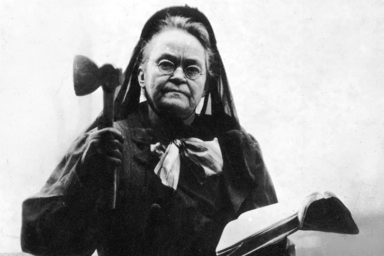 Carrie Nation, with axe and Bible