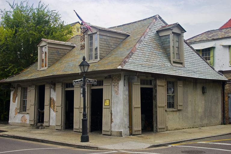 Hipped roof defines 18th century French Provincial Lafitte's Blacksmith Shop in New Orleans, LA