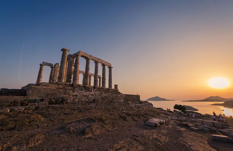 Temple Of Poseidon at sunset in Sounio cape in Attica region, Greece