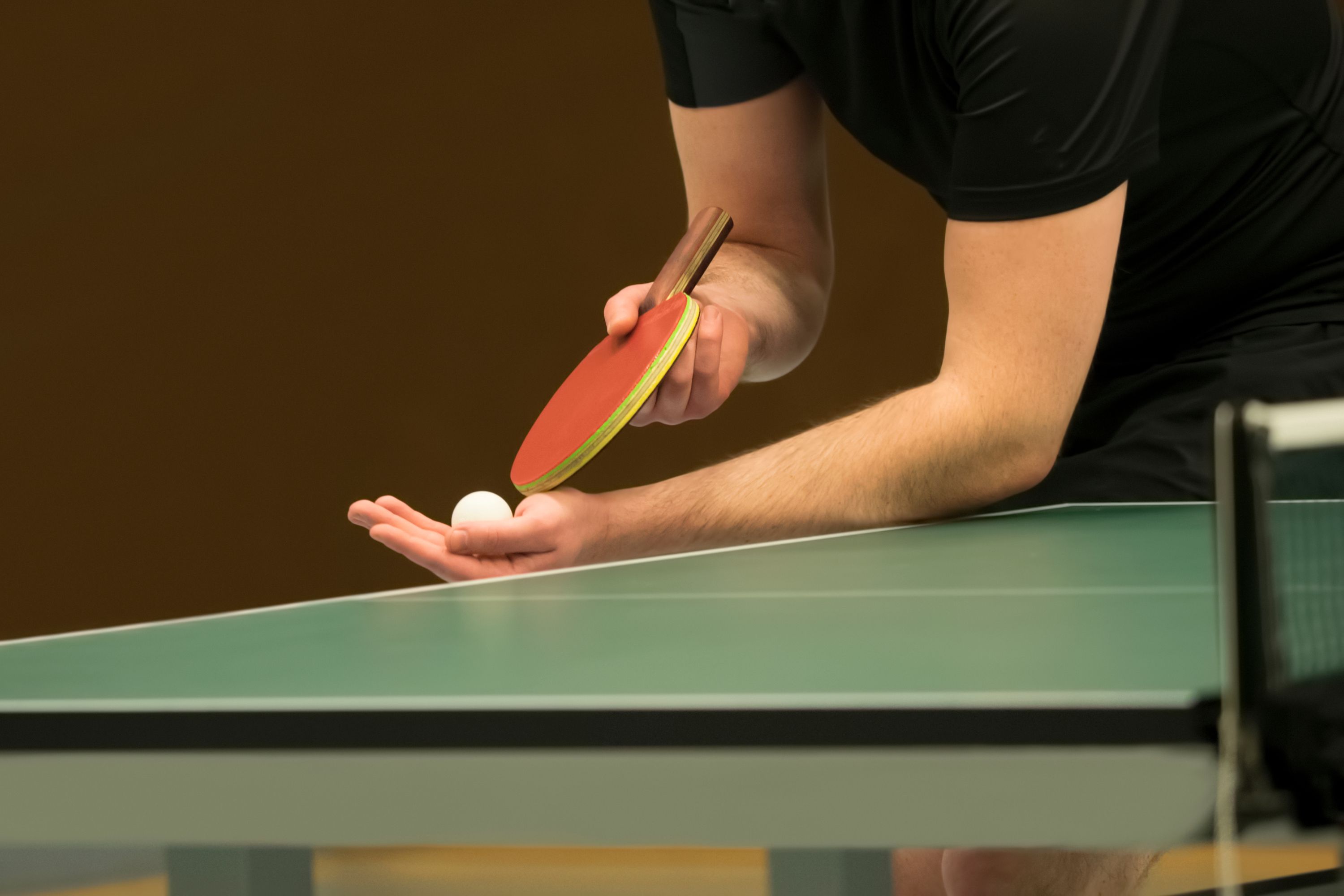 Midsection Of Man Serving While Playing Table Tennis 735961119 59f0b6aeaad52b0010378181 