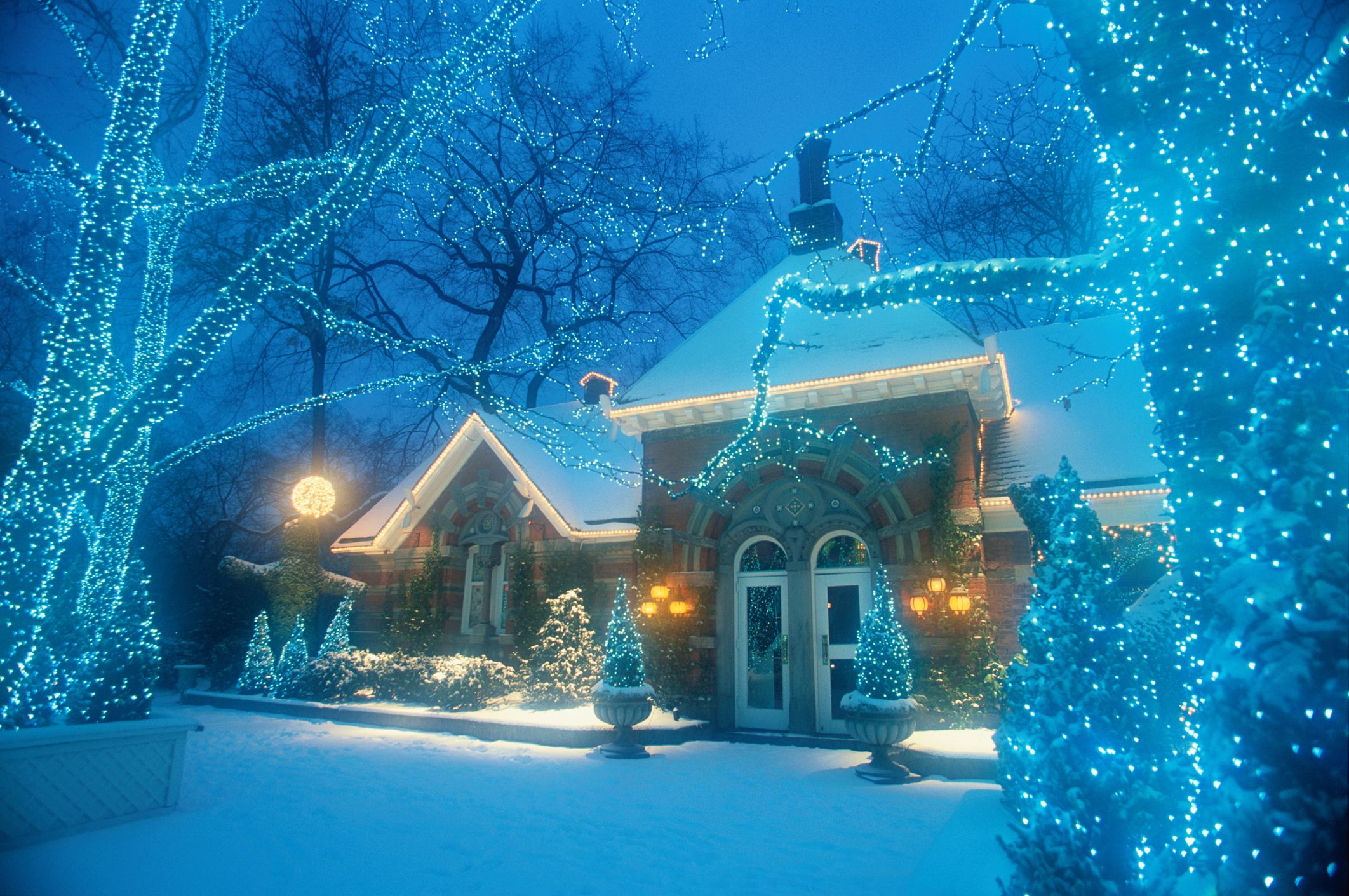 christmas decorating outdoor lights decoration winter big decorations snow scene blue wonderland homes nighttime trees getty