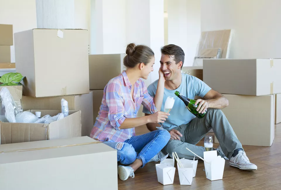 Couple celebrating in new home