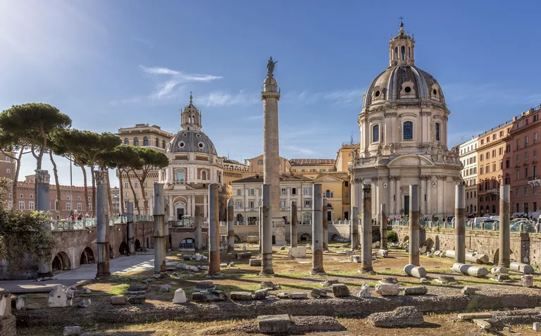 Trajans Forum with Trajans Column and columns of the Basilica Ulpia, at back right churches of Chiesa SS Nome di Maria e Bernardo, left Santa Maria di Loreto, Rome, Lazio, Italy