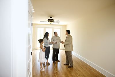 Family with realtor in new home