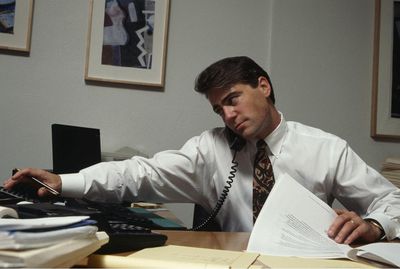 business man on telephone at desk