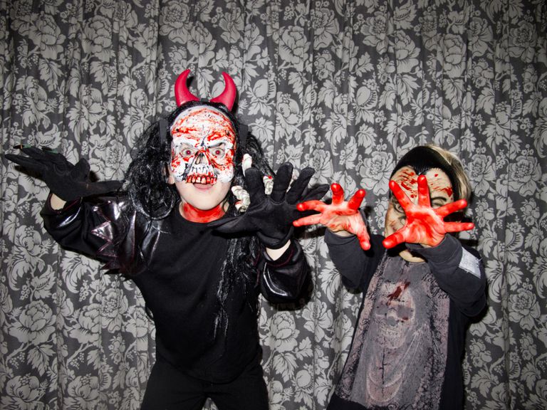 Two kids dressed up as monsters.