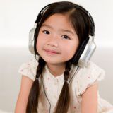A picture of a girl listening to headphones