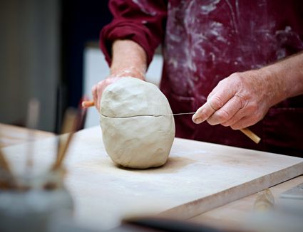 Download Preparing to Center Clay on the Potter's Wheel