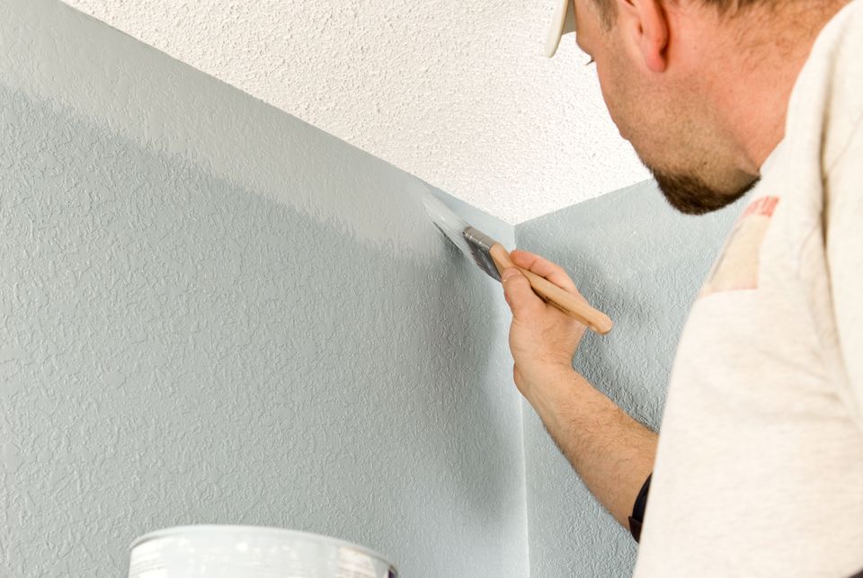 Paint Taping Vs Cutting In Which One Is Best   Painter Cutting In Wall 157570457 56a4a0db5f9b58b7d0d7e4d2 