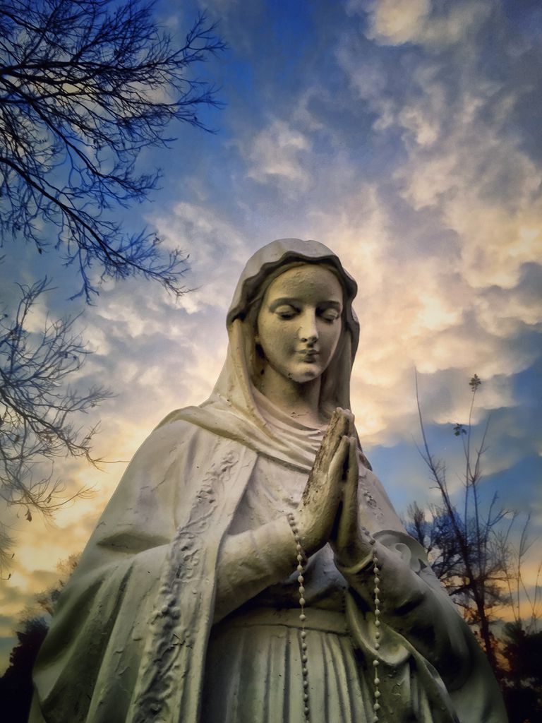 low angle view of virgin mary statue against cloudy sky 58ab3f063df78c345b031f7f