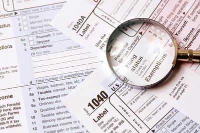 Tax form and magnifying glass