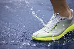 running shoe splashing water