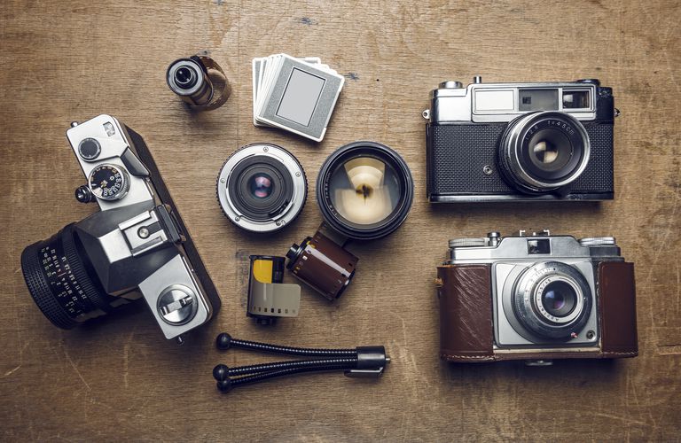 photographic equipment, cameras, slides, lenses, rolls of film