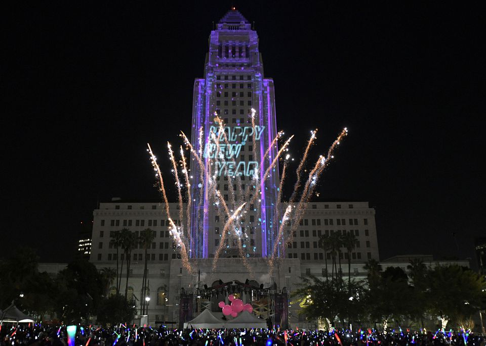 City hall beling lit up during the NYE Party in Grand Park LA