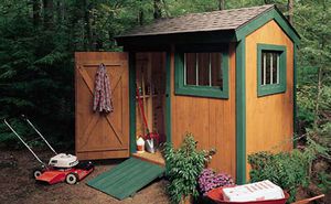 Brown shed with green trim