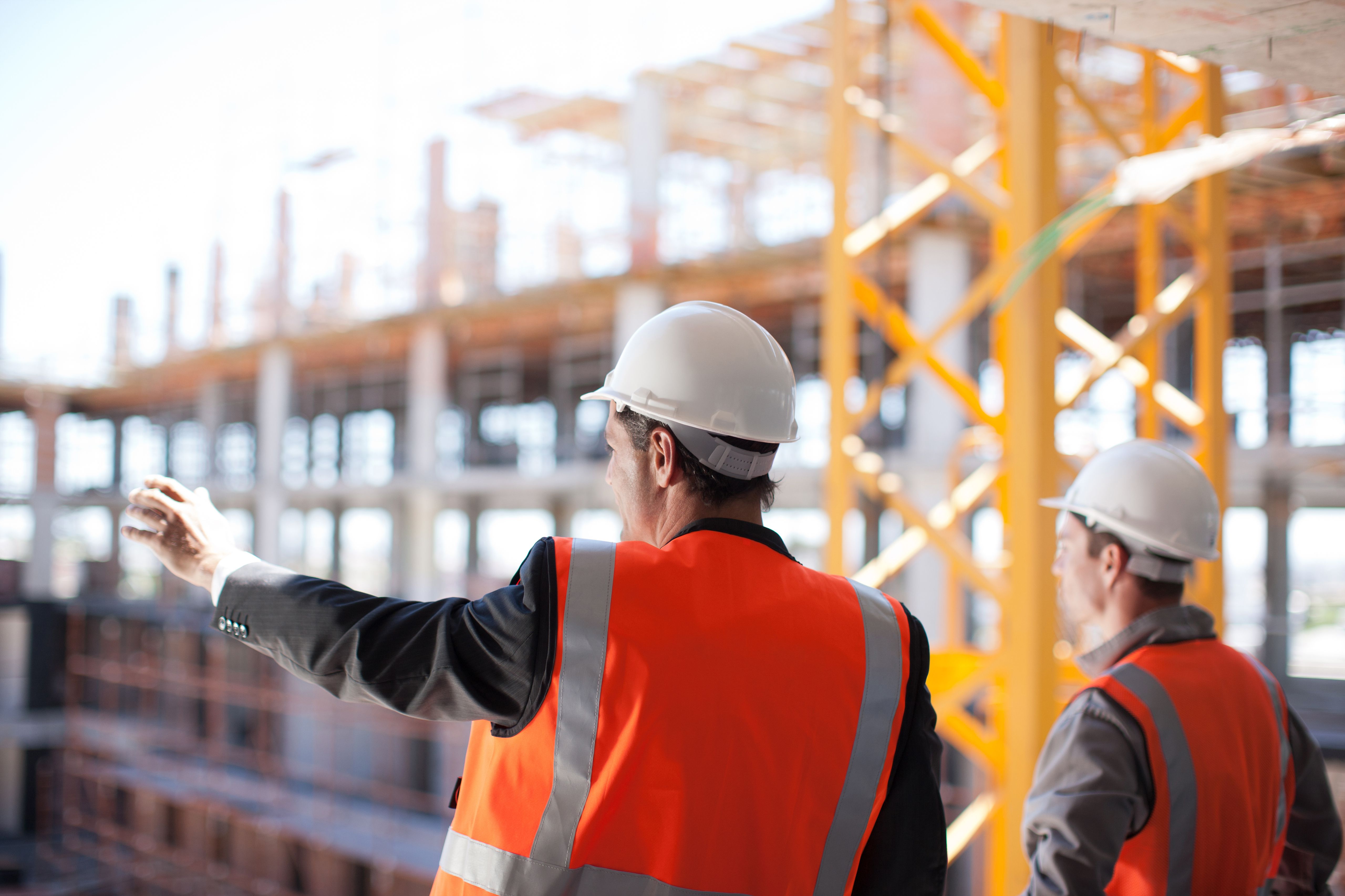 Construction Workers Working On Construction Site 170961868 5a4c47a6c7822d0037360497 