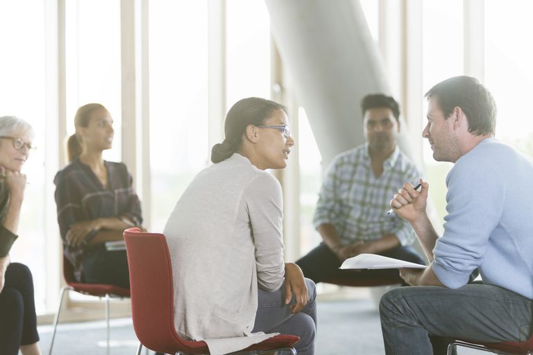 People sitting in a circle talking