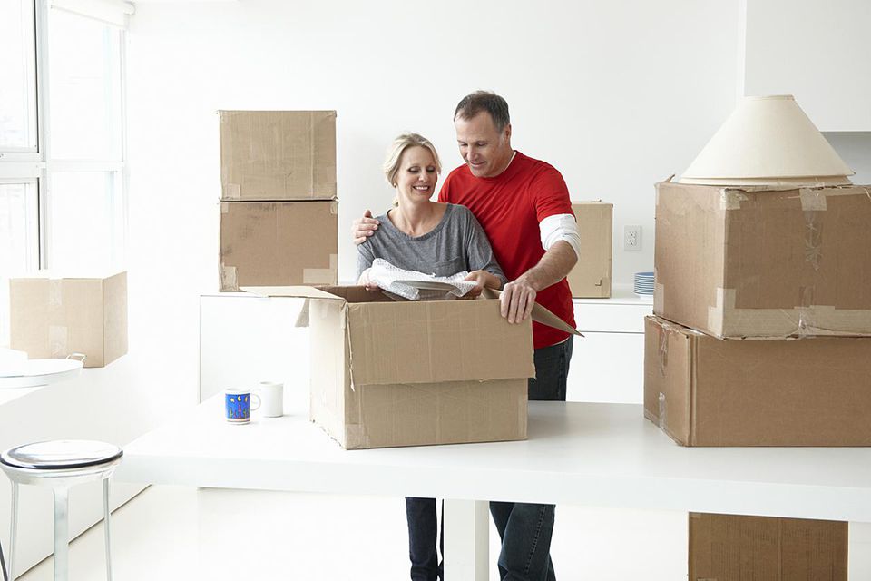 Couple packing a box