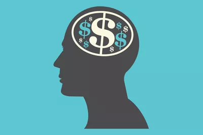 dollar signs on profile of human head