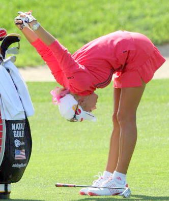 Professional golfer Natalie Gulbis Stretches during a match
