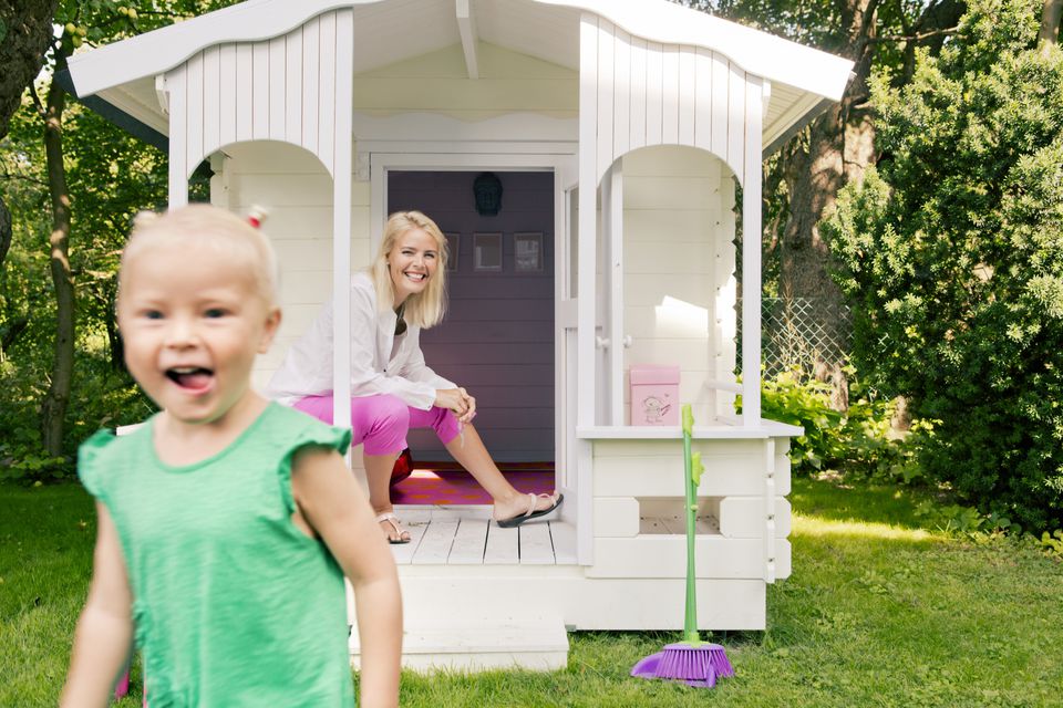 little girl with playhouse