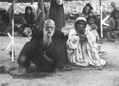 A Gypsy couple sitting in Belzec.