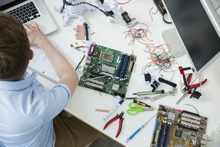 man repairing computer