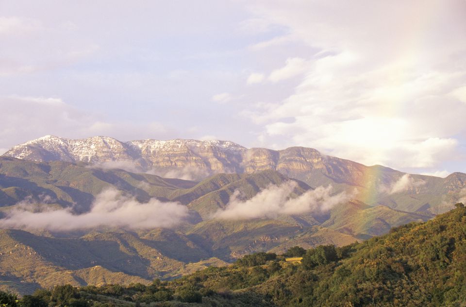 Rainbow and clouds over mountains