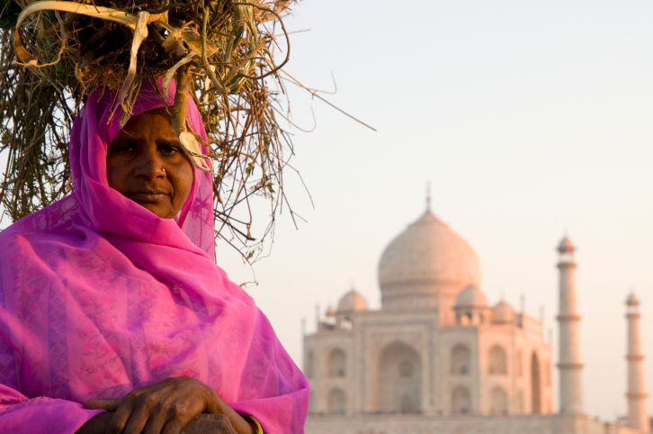 An Indian woman in front of the Taj Mahal, Agra.