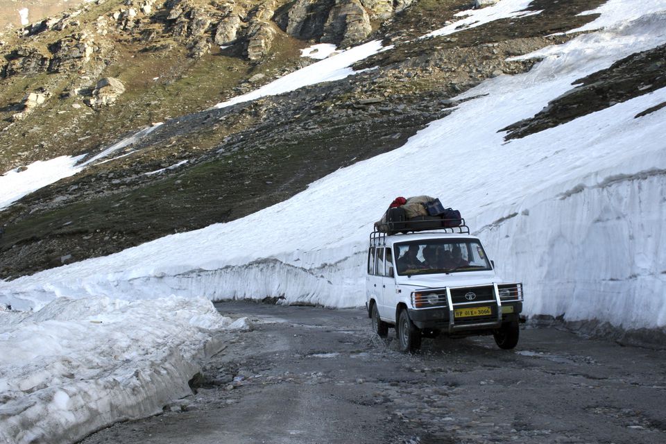 Tourist jeep passing through Rohtang Pass in Manali, Himachal Pradesh, India.