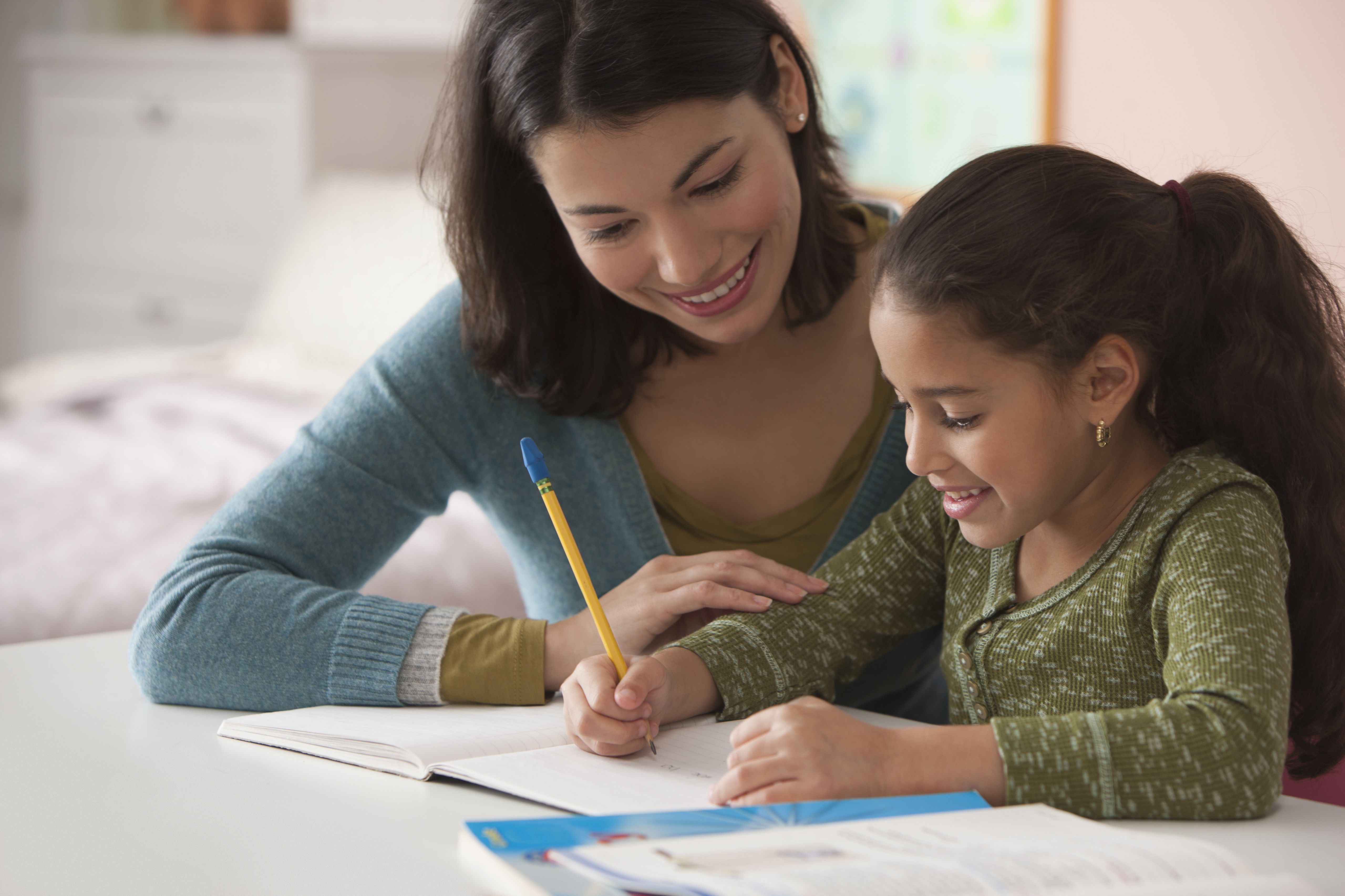 mom helping child with homework