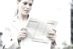 Woman looking at stock reports