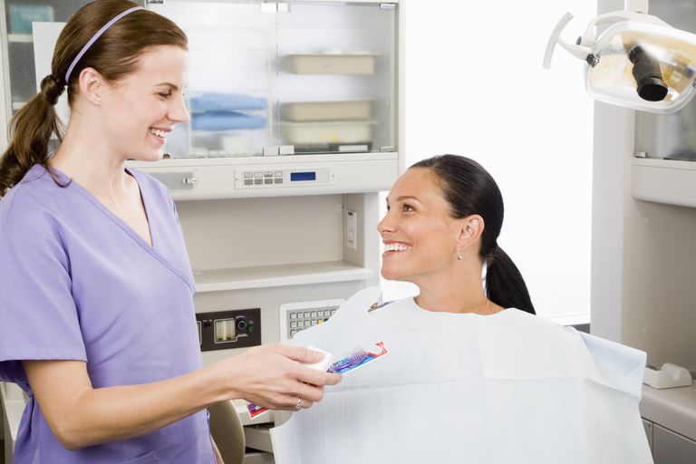 dental hygienist and patient