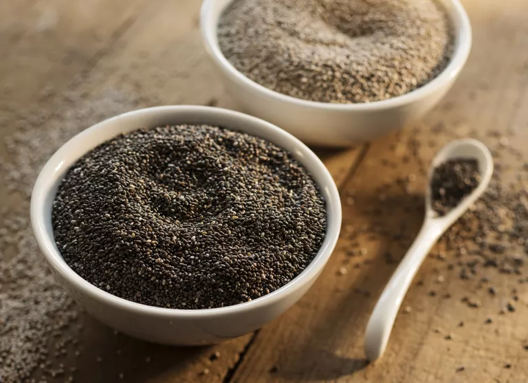 bowls of white and black chia seeds