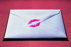 An envelope with a kiss on it