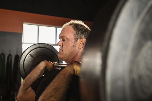 Mature man shoulder pressing