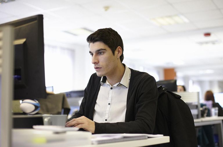 Young man using computer in office