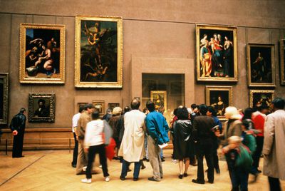 France, Paris, Louvre, visitors looking at Mona Lisa