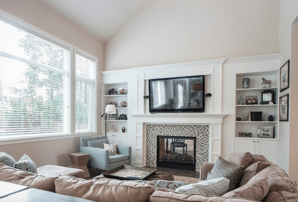 living room with mosaic fireplace