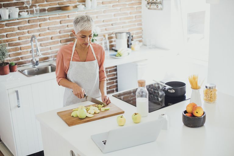 Woman preparing healthy meal in kitchen