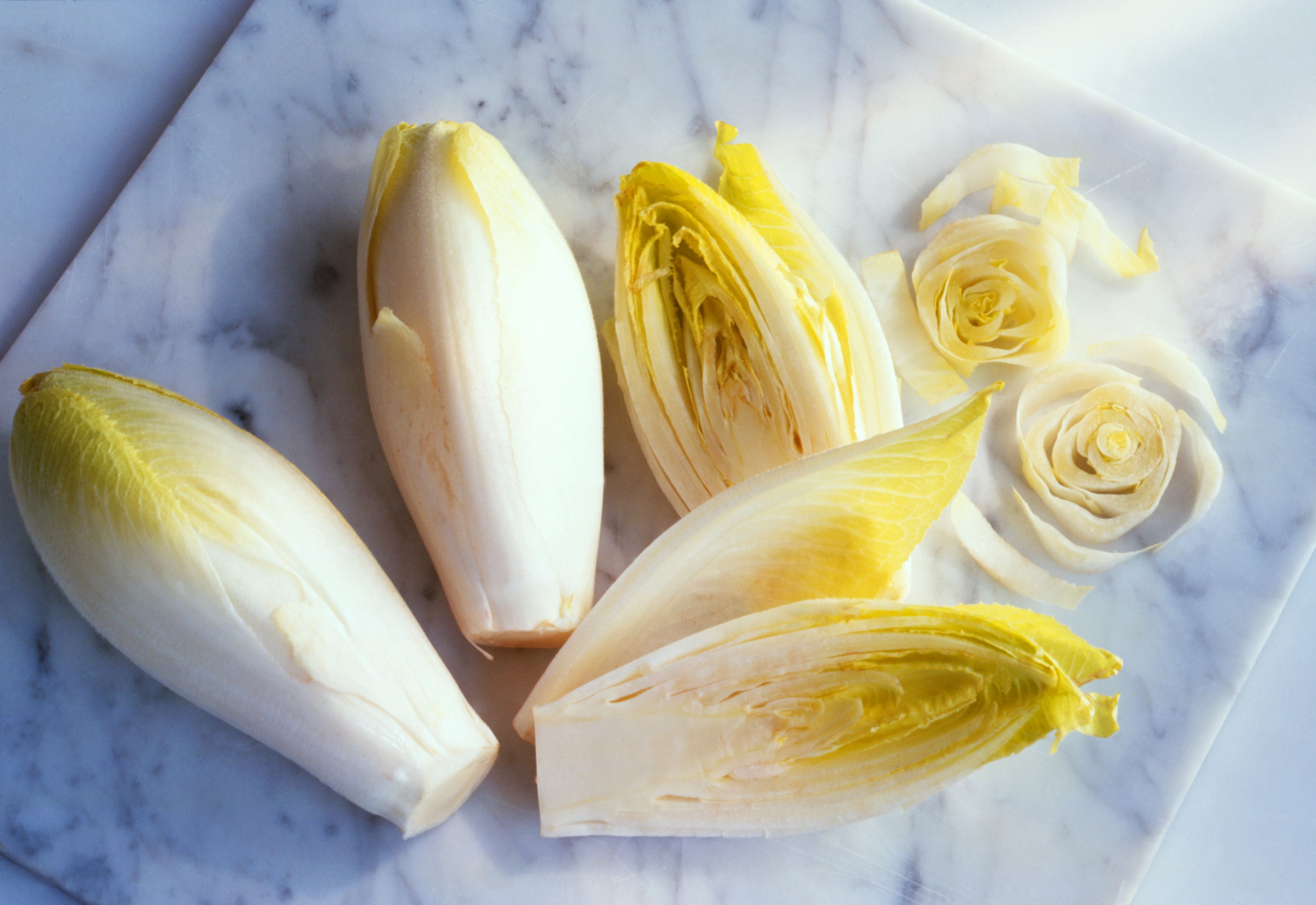 chicory whole and sliced on marble board 126551420 58bdd3d85f9b58af5c3bf47b